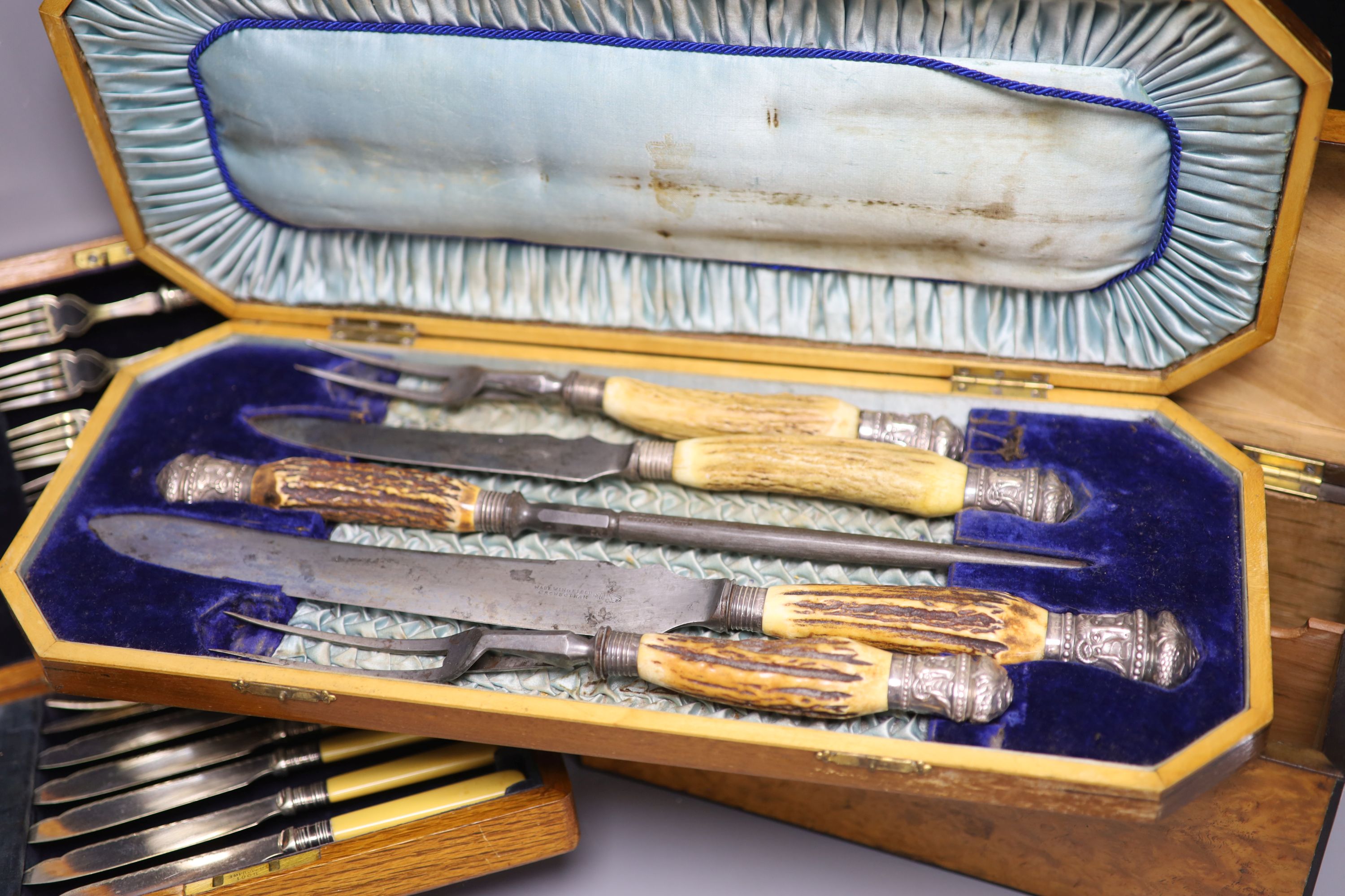 Four cased plated sets and a walnut box
